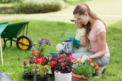 Garden clearance crew preparing tools and van